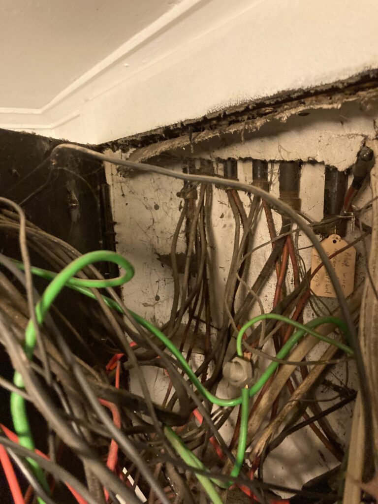 Wiring behind an old switchboard - Christchurch home inspection